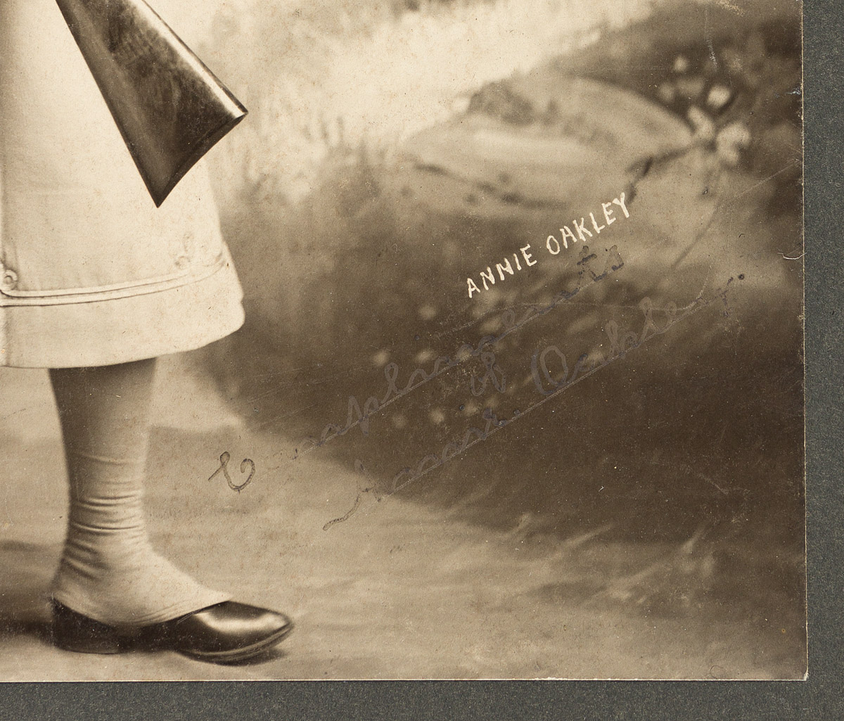 OAKLEY, ANNIE. Photograph Signed and Inscribed, Compliments,